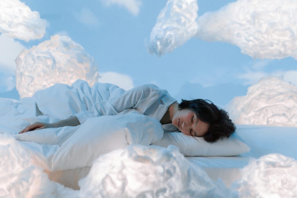 pexels photo 8264248 8264248 A serene and imaginative portrayal of a woman sleeping surrounded by fluffy clouds.